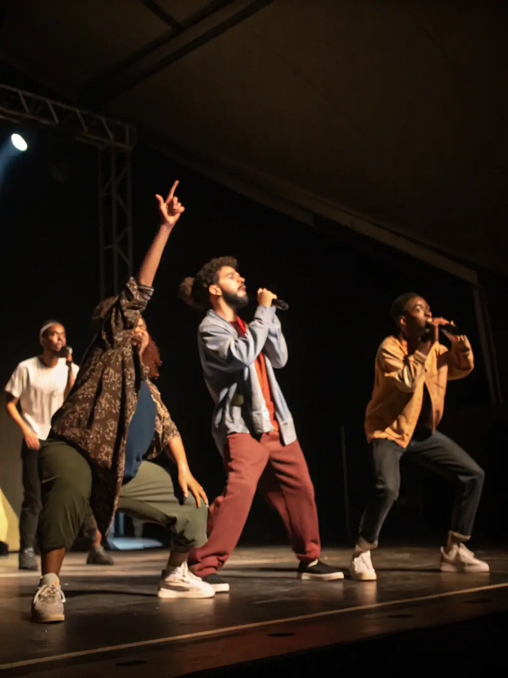 A photo of a performance art event, with artists engaging the audience through movement and expression at LE GRAND ATELIER.